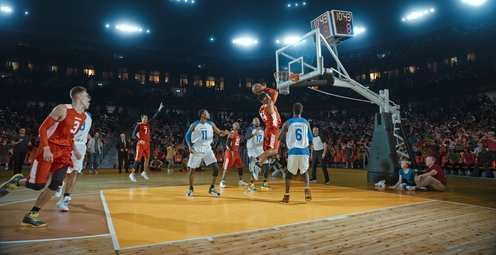 Two NBA teams playing basketball in a high tech professional arena while scoring a point